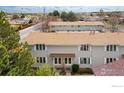 Charming townhome features well-maintained landscaping and a welcoming entrance at 1915 S Oakland Way, Aurora, CO 80014