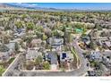 Beautiful aerial view of property highlighting its location within a lush, green neighborhood with mature trees and manicured lawns at 2672 Winding Trail Dr, Boulder, CO 80304