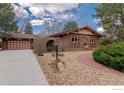 Well-maintained single-story brick home with attached garage and beautiful landscaping at 285 Hopi Pl, Boulder, CO 80303