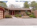 Charming single-story brick home featuring a well-manicured front yard at 285 Hopi Pl, Boulder, CO 80303