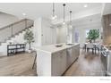 Contemporary kitchen featuring a center island, pendant lighting, and an adjacent dining area at 2909 32Nd St, Boulder, CO 80301