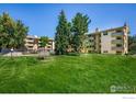 Spacious, well-maintained backyard with mature trees, offering a serene and private outdoor space at 3035 Oneal Pkwy # T, Boulder, CO 80301