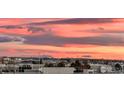 Beautiful sunset colors paint the sky above a city skyline at 3401 Arapahoe Ave # 402, Boulder, CO 80303
