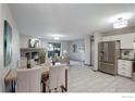 Open concept living area with fireplace and sliding glass door at 3785 Birchwood Dr, Boulder, CO 80304