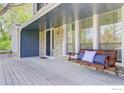 Inviting front porch with porch swing and stone accents at 4251 Peach Way, Boulder, CO 80301