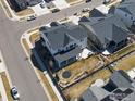 Birds-eye view of a two-story home with fenced yard, patio, and trampoline at 904 Sundown Way, Erie, CO 80516
