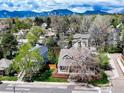 Stunning aerial view showcasing the property, neighborhood, and the mountain range in the background at 945 Lincoln Ave, Louisville, CO 80027