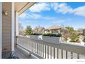 Balcony view with flower boxes overlooking neighborhood street at 1339 Carlyle Park Cir, Highlands Ranch, CO 80129