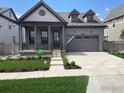 Charming single-Gathering home featuring a covered front porch and two-car garage at 1581 Poplar Dr, Erie, CO 80516