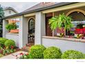 Inviting covered front porch, featuring arch window accents and colorful seating at 2019 S Grant St, Denver, CO 80210