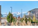 Scenic view showcasing the beautiful snow-capped mountains in the distance from the property at 2482 Claystone Cir, Erie, CO 80516