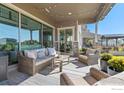 Stylish outdoor seating area with comfortable furniture, creating an inviting space for relaxation and gatherings at 2482 Claystone Cir, Erie, CO 80516