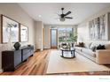 Bright living room features a large window, plush sofa, and hardwood floors at 3734 Ridgeway St, Boulder, CO 80301