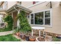 Close up exterior view of a home with climbing plants and a small front yard at 3840 Colorado Ave # D, Boulder, CO 80303