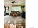 Cozy living room featuring a large window, comfortable seating, and a decorative rug at 700 33Rd St, Boulder, CO 80303