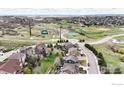 Enjoy community living, with a beautiful aerial view of the neighborhood and community green spaces at 7281 Arco Iris Ln, Castle Pines, CO 80108