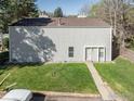 Exterior shot of the property highlighting the vertical siding, brown roof and walkway at 8050 Niwot Rd # 37, Niwot, CO 80503