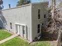 Exterior view of property featuring vertical siding, well-maintained lawn and paint cans at 8050 Niwot Rd # 37, Niwot, CO 80503