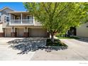 Beautiful multi-level townhome with attached two-car garage and meticulous landscaping at 13024 Grant E Cir, Thornton, CO 80241