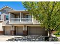 Desirable multi-level townhome boasting a private balcony and a convenient attached two-car garage at 13024 Grant E Cir, Thornton, CO 80241