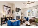 Inviting living room featuring a fireplace, plush seating, and stylish decor for comfortable living at 1481 Harebell St, Berthoud, CO 80513