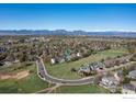 Expansive aerial shot highlighting neighborhood near open green space and mountain views at 1809 Keel Ct, Lafayette, CO 80026