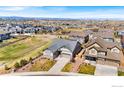 Stunning aerial view of a well planned neighborhood with mountain views and beautifully landscaped homes at 1839 Pinion Wing Cir, Castle Rock, CO 80108