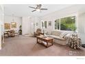 Inviting living space with ample natural light, comfortable seating, and an open layout at 2239 Calais Dr # F, Longmont, CO 80504