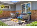 Outdoor patio area featuring comfortable seating and surrounded by lovely plants at 27 Cornell Dr, Longmont, CO 80503