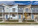 Townhomes with private balconies and fenced yards offer a sense of community at 2732 Bear Springs Cir, Longmont, CO 80503