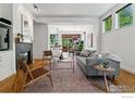 Bright living room featuring hardwood floors, fireplace, and an open floor plan perfect for entertaining at 3272 Big Horn St, Boulder, CO 80301