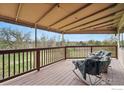 Relaxing covered patio with comfortable seating and scenic views at 4212 E Orchard Pl, Centennial, CO 80121