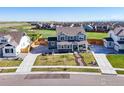Well-manicured front yard and great street appeal from the aerial view of this two-story home at 437 Buckskin Rd, Berthoud, CO 80513