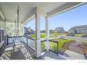 Inviting front porch with swing, offering a relaxing outdoor space and neighborhood views at 437 Buckskin Rd, Berthoud, CO 80513