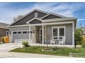 Charming single-Gathering home featuring a two-car garage and cozy front porch with seating at 741 Kohlor Dr, Lafayette, CO 80026