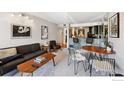 Contemporary living room featuring stylish seating, modern decor, and a view into the kitchen at 805 29Th St # 308, Boulder, CO 80303