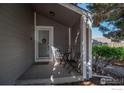 Cozy front porch with seating, creating a welcoming entryway to the home at 87 Macon Ct, Aurora, CO 80010