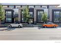 Attractive condo building featuring a mixed facade of stone, dark siding and multiple balconies at 1707 Walnut St # 104, Boulder, CO 80302