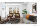 Bright living room featuring large windows, modern decor, and an open layout at 1707 Walnut St # 203, Boulder, CO 80302