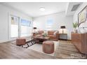Cozy living room showcasing contemporary furniture, wood flooring, and bright, neutral tones at 1707 Walnut St # 207, Boulder, CO 80302