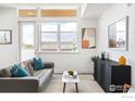 Stylish living room featuring a modern sofa, designer coffee table, and contemporary decor at 1707 Walnut St # 306, Boulder, CO 80302