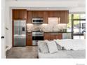 Modern kitchen with stainless steel appliances, sleek countertops, and stylish wood cabinets at 1838 22Nd St, Boulder, CO 80302