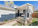 Welcoming front porch with seating area, offering a cozy and inviting space at 1920 Donovan Dr, Longmont, CO 80501