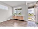 Open entryway with natural light, wood flooring, and view of the outside at 2161 Gelbvieh St, Mead, CO 80542