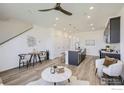A bright, modern living space featuring an open-concept design, sleek furniture, and contemporary lighting, creating a welcoming atmosphere at 2743 Bear Springs Cir, Longmont, CO 80503