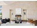 Cozy living room with a modern fireplace, complemented by stylish seating and neutral decor at 2848 S Lakeridge Trl, Boulder, CO 80302
