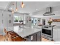 Bright, open kitchen featuring an island, stainless steel appliances, and pendant lighting at 301 29Th St, Boulder, CO 80305