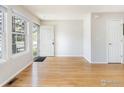 Inviting living room with hardwood floors and a bright front door entrance at 3098 W 107Th Pl # C, Westminster, CO 80031