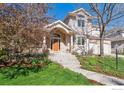 A beautiful home with a brick facade, manicured lawn, and a welcoming entryway at 4059 Nevis St, Boulder, CO 80301