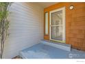 Inviting entryway featuring a storm door, exterior lighting, and neutral finishes at 4619 Chestnut Ln, Boulder, CO 80301